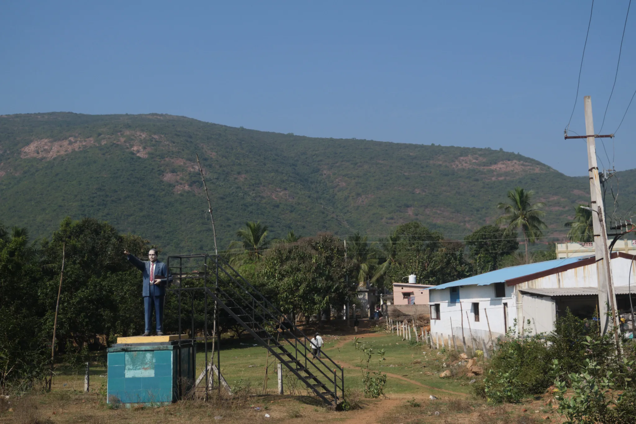 A statue of Dr. B.R. Ambedkar, a Dalit leader, towers over Tarluvada, a rural village in Andhra Pradesh. Google is partnering with state authorities to acquire 200 acres of land from Dalit families to build a massive 1GW data center campus — its largest data center outside the United States. Photo by Shamsheer Yousaf.