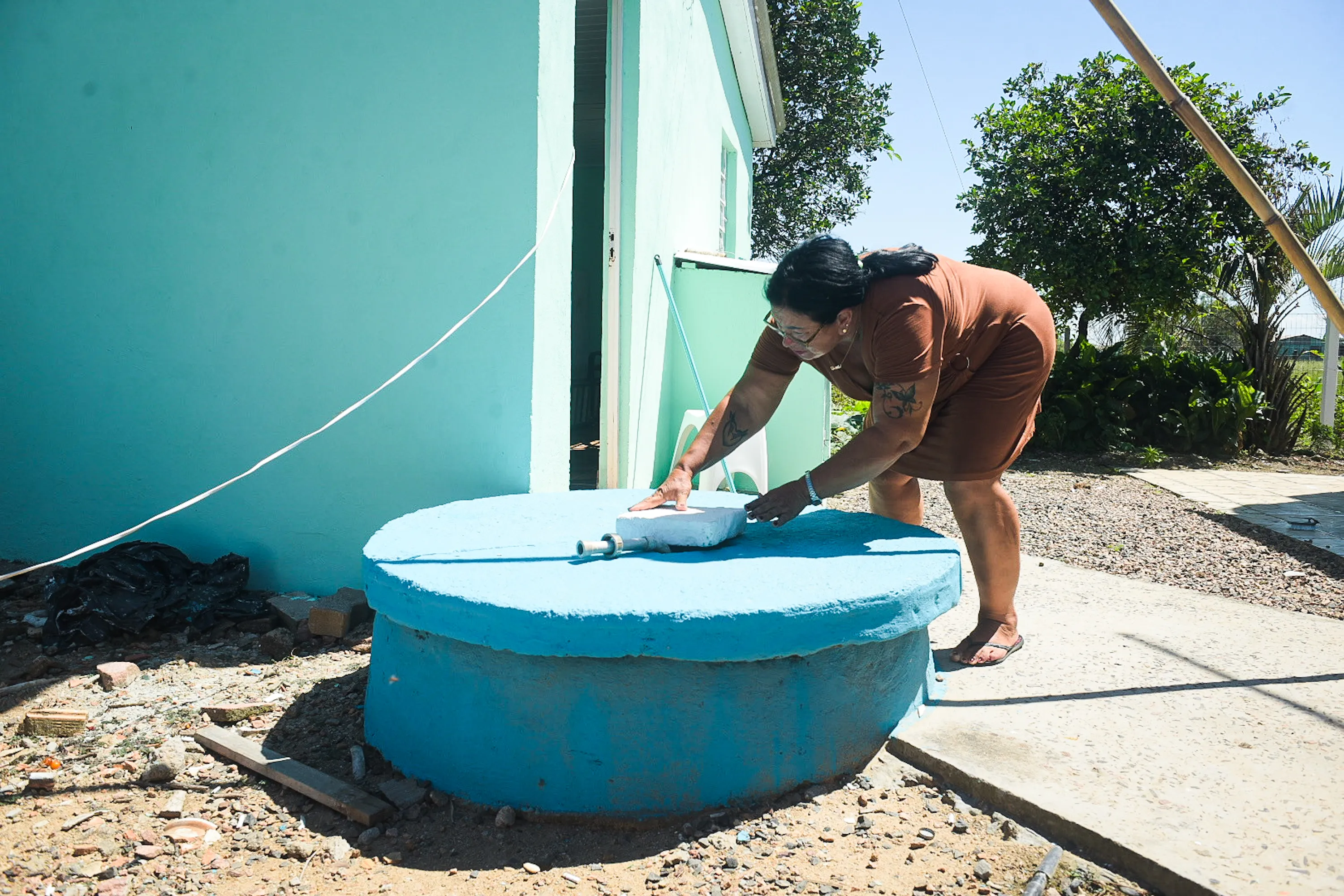 Souza, a community leader who has lived in Guaíba City for close to three decades, wonders whether the data center could affect the wells that supply water for her family. Photo by Alass Derivas