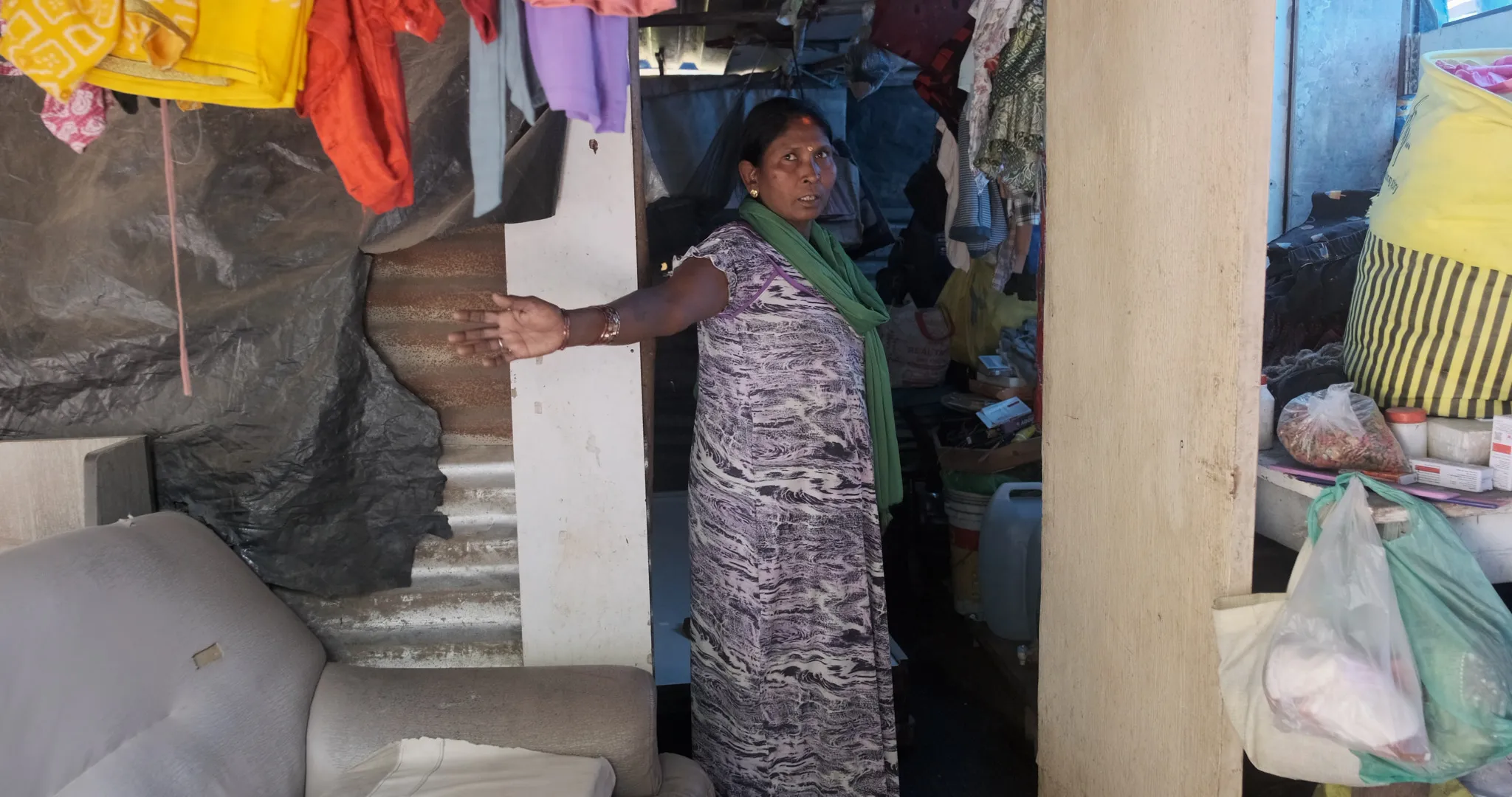 Shrimati Chauhan shows her makeshift home in Jai Bhim Nagar, Hiranandani Gardens, where she has lived with her family since their eviction in June 2024 from the home they occupied for three decades.