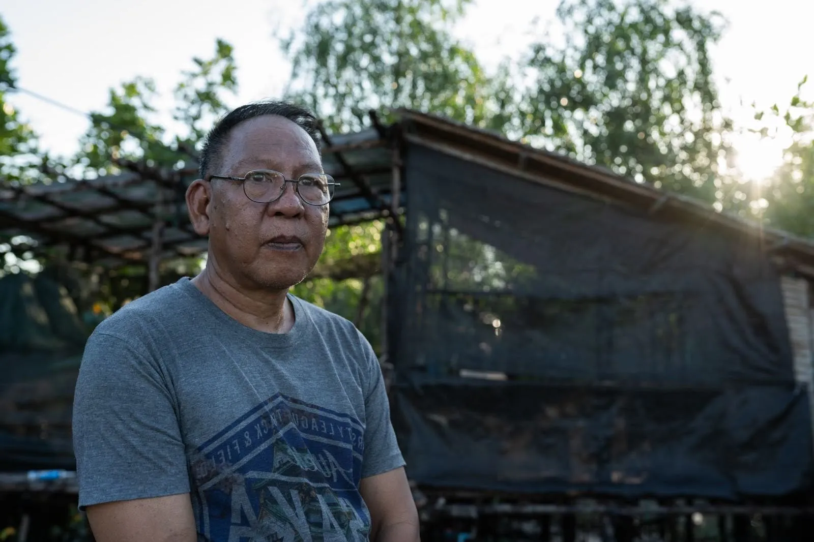 A portrait of environmental activist Chaweerat Phanprasirt, otherwise known as Toy, in Chonburi province, Thailand, on Dec. 16, 2025. Photo by Andy Ball for Mongabay.